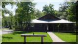 A big shady porch surrounds the "Big House"